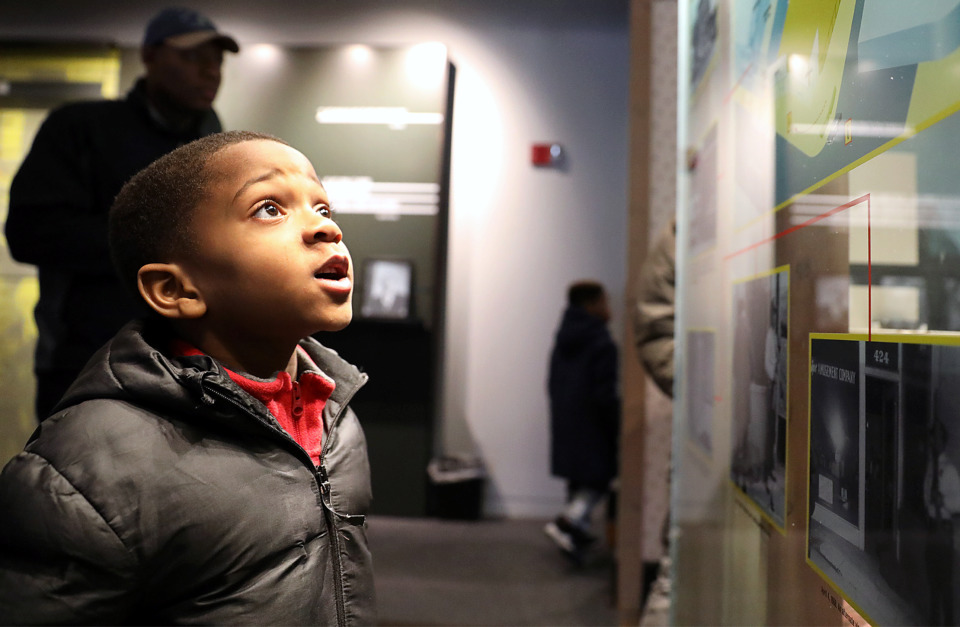 <strong>&ldquo;Wow,&rdquo; says young Timothy Mukupya while his father reads along with him in the background during a visit to the National Civil Rights Museum to pay homage on Martin Luther King Jr. Day Monday, Jan. 21.</strong> (Patrick Lantrip/Daily Memphian)