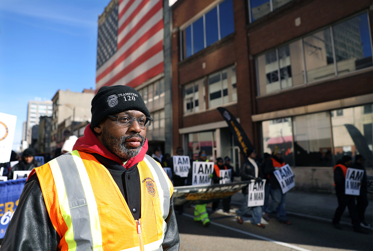 <strong>James Curbeam helps lead the Martin Luther King Jr. Day parade from the Pinch District to the National Civil Rights Museum Monday, Jan. 21. Curbeam led his fellow Teamsters in chants of, &ldquo;No justice, no peace,&rdquo; and other powerful slogans as the parade advanced through Downtown Memphis.</strong> (Patrick Lantrip/Daily Memphian)