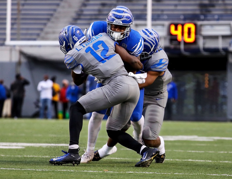 <strong>University of Memphis tight end Sean Dykes (5) is tackled during the Tigers&rsquo; spring game at the Liberty Bowl April 16.</strong> (Patrick Lantrip/Daily Memphian)
