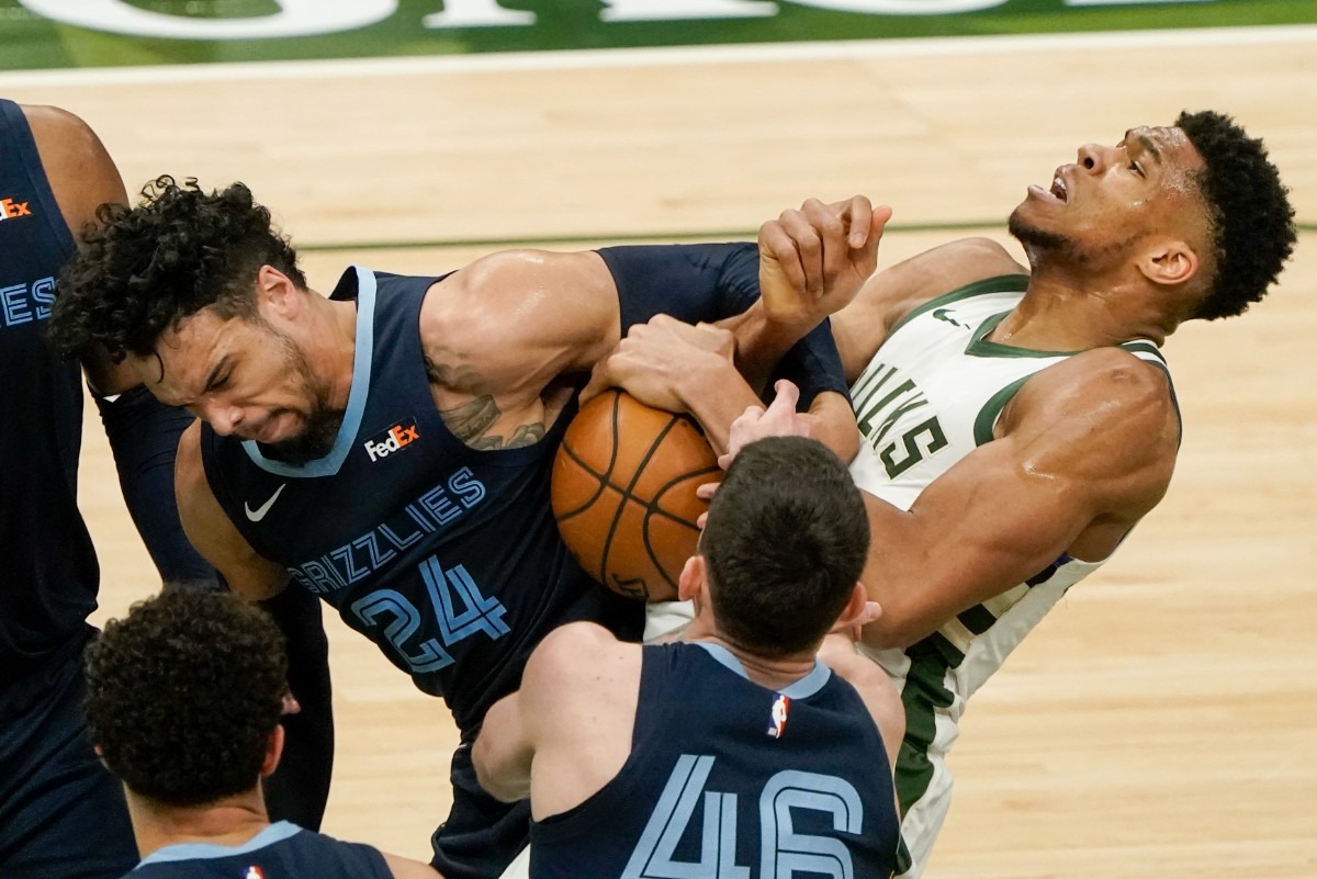 <strong>Milwaukee Bucks' Giannis Antetokounmpo and Memphis Grizzlies' Dillon Brooks battle for a loose ball during&nbsp;an NBA basketball game Saturday, April 17, 2021, in Milwaukee.</strong> (Morry Gash/AP)