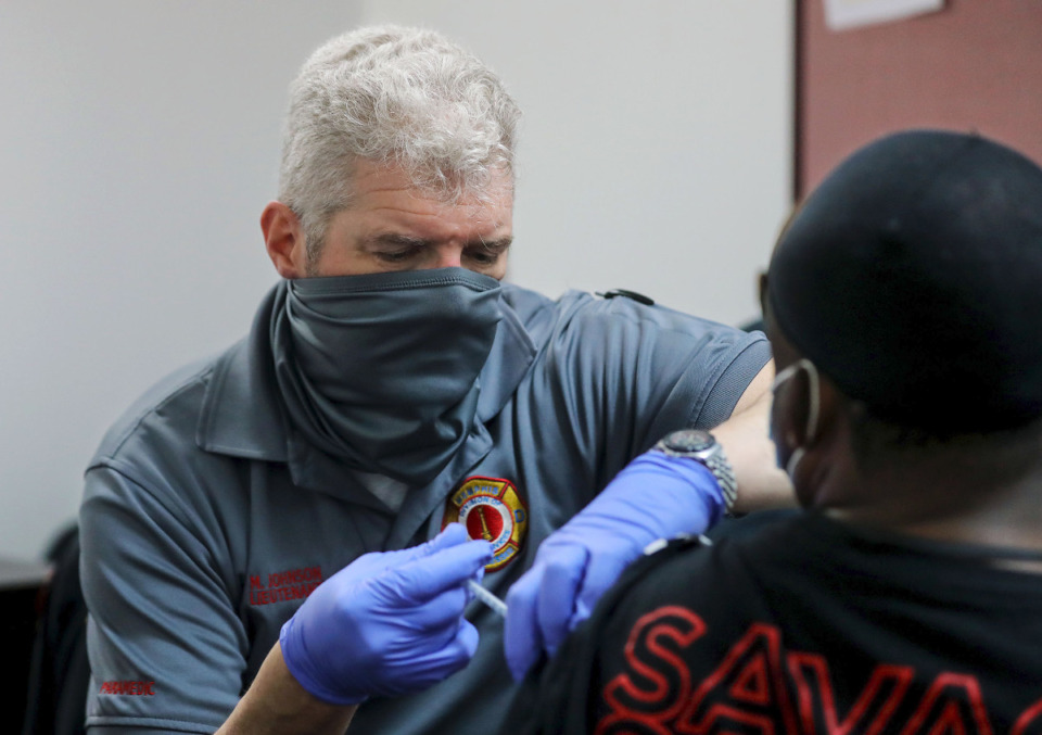 <strong>Lt. Mark Johnson administers a COVID-19 vaccine at the Union Mission March 19, 2021.</strong> <strong>The Shelby County Health Department reported 145 new coronavirus cases and 3 additional deaths Sunday.</strong> (Patrick Lantrip/Daily Memphian file)