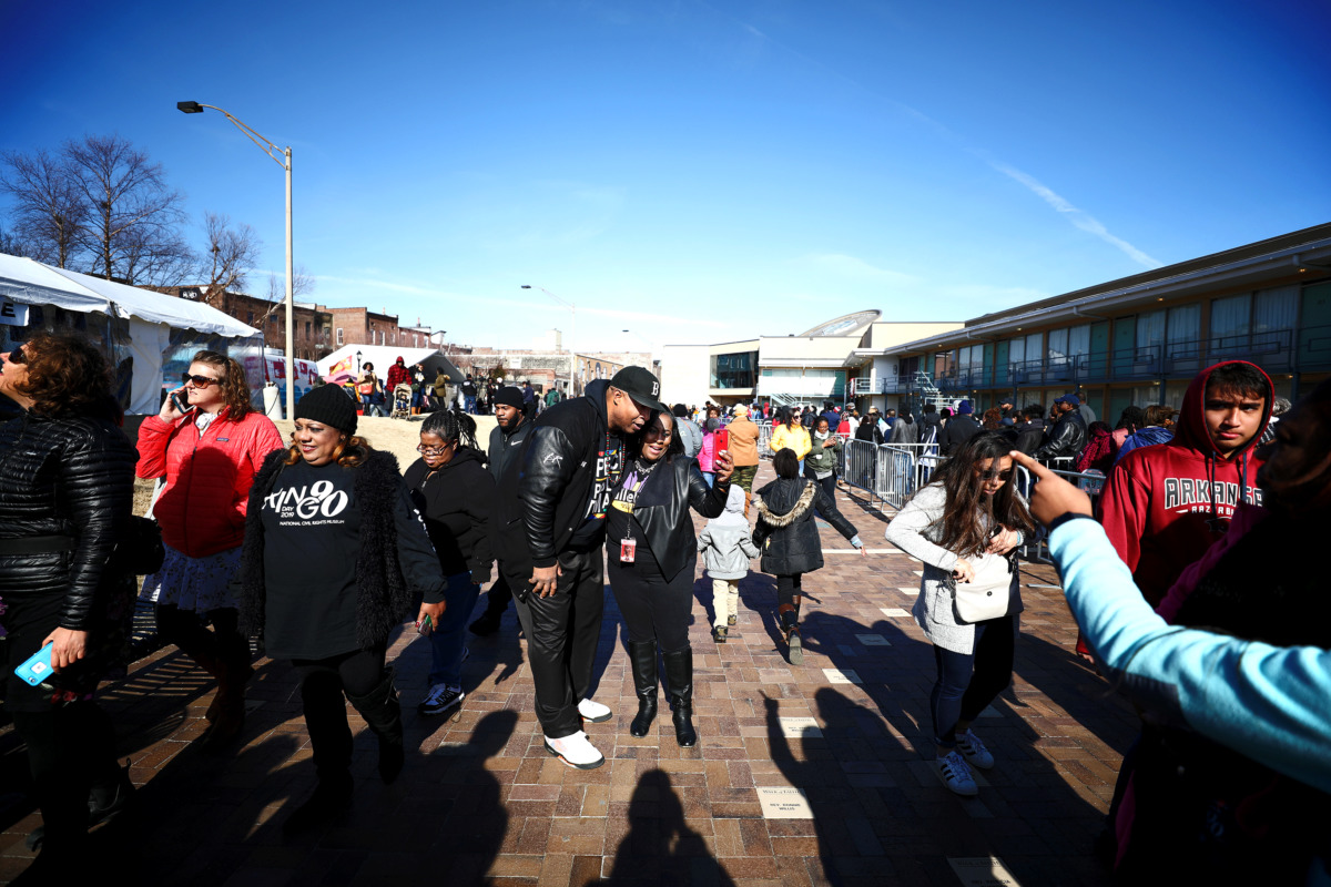 <strong>Sherry Mackey (right), from 95.7 FM, and John Best (left), from 88.5 FM, greet fans while making a Facebook Live video from the National Civil Rights Museum on Martin Luther King Jr. Day 2019.</strong> (Houston Cofield/Daily Memphian)