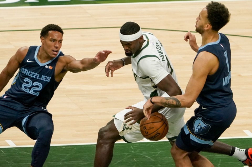 <strong>Milwaukee Bucks' Bobby Portis battles for the ball with Memphis Grizzlies' Desmond Bane and Kyle Anderson during the first half of an NBA basketball game Saturday, April 17, 2021, in Milwaukee.</strong> (Morry Gash/AP)