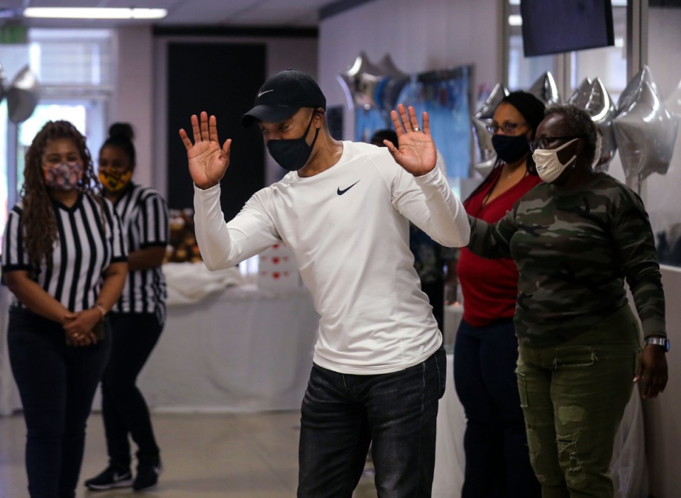 <strong>Former University of Memphis guard Andre Turner gets surprised by his coworkers March 25, 2021.</strong> (Patrick Lantrip/Daily Memphian)