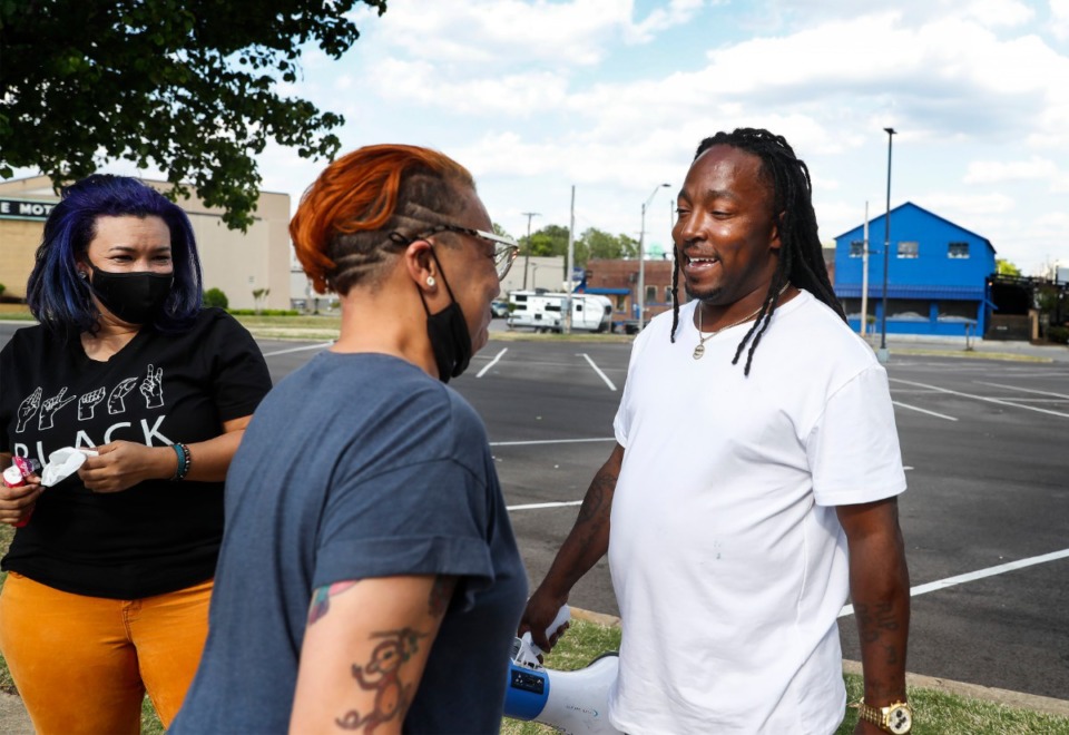 <strong>Local activists Theryn Bond, (left) LJ Abraham (middle) and Frank Gotti celebrate after a jury found former Minneapolis police officer Derek Chauvin guilty of murder and manslaughter April 20.</strong> (Mark Weber/The Daily Memphian)