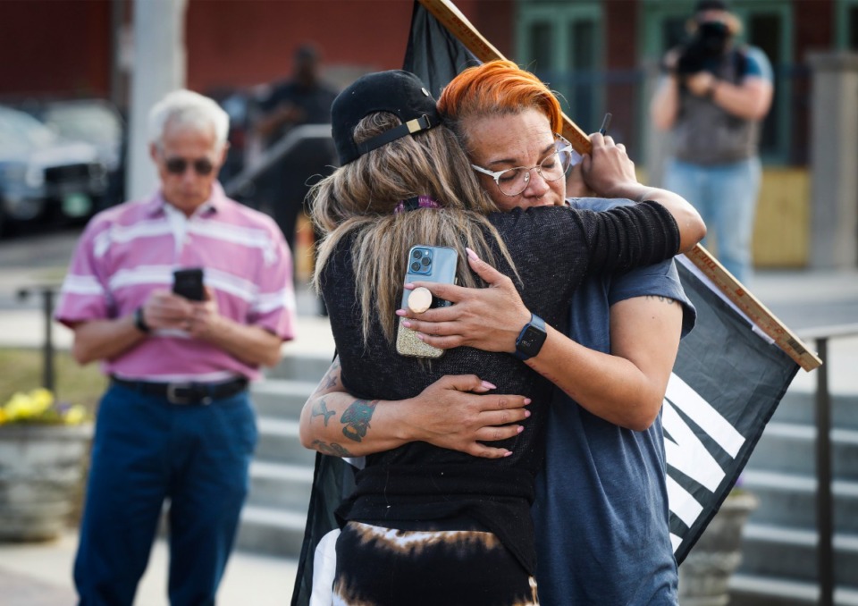 <strong>Local activists Bluu Davis (left) and LJ Abraham (right) hug outside the National Civil Rights Museumon April 20.</strong> (Mark Weber/The Daily Memphian)