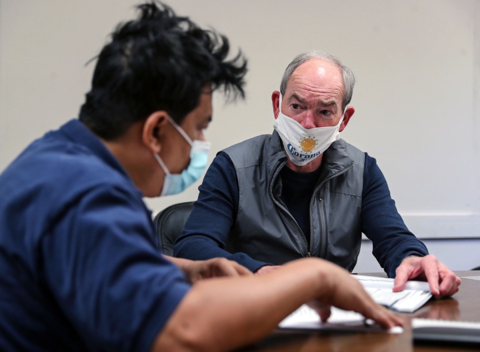 <strong>ESL volunteer Davis Woods works with Hung Nguyen, who immigrated from Vietnam five years ago at the Collierville Literacy Council April 21, 2021.</strong> (Patrick Lantrip/Daily Memphian)