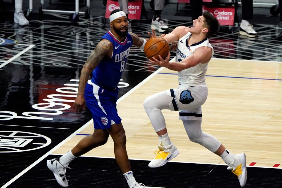 <strong>Grizzlies guard Grayson Allen, right, drives to the basket next to Los Angeles Clippers forward Marcus Morris Sr. on April 21 in Los Angeles.</strong> (Marcio Jose Sanchez/AP)