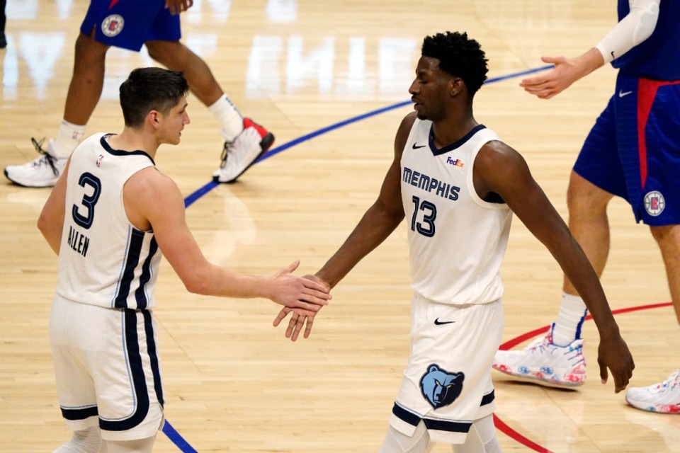 <strong>Memphis Grizzlies forward Jaren Jackson Jr. (13) shakes hands with guard Grayson Allen (3) during the second half of the team's NBA basketball game against the Los Angeles Clippers on Wednesday, April 21, 2021, in Los Angeles.</strong> (AP Photo/Marcio Jose Sanchez)