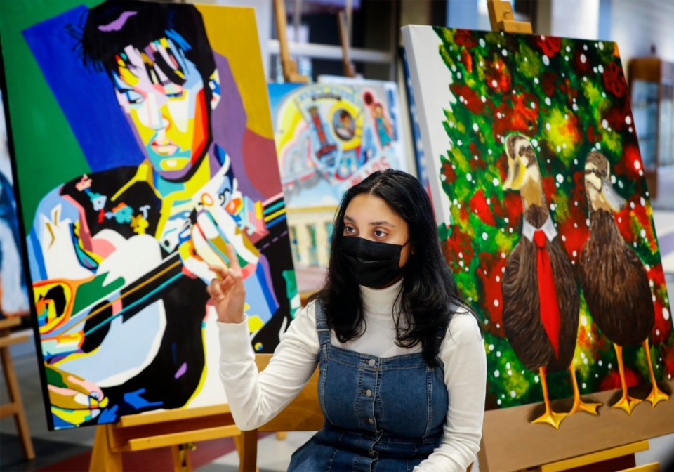 <strong>Collierville High School junior Diya Singh talks about her Elvis painting on Tuesday, April 20, 2021. Singh and 16 of her classmates won an art competition to have their artwork featured at the Memphis International Airport.</strong> (Mark Weber/The Daily Memphian)