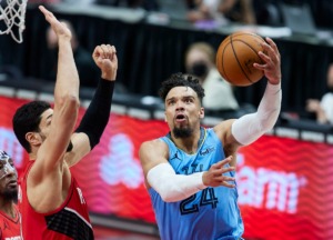 <strong>Grizzlies forward Dillon Brooks, right, shoots over Portland Trail Blazers center Enes Kanter on April 23, 2021.</strong> (Craig Mitchelldyer/AP)