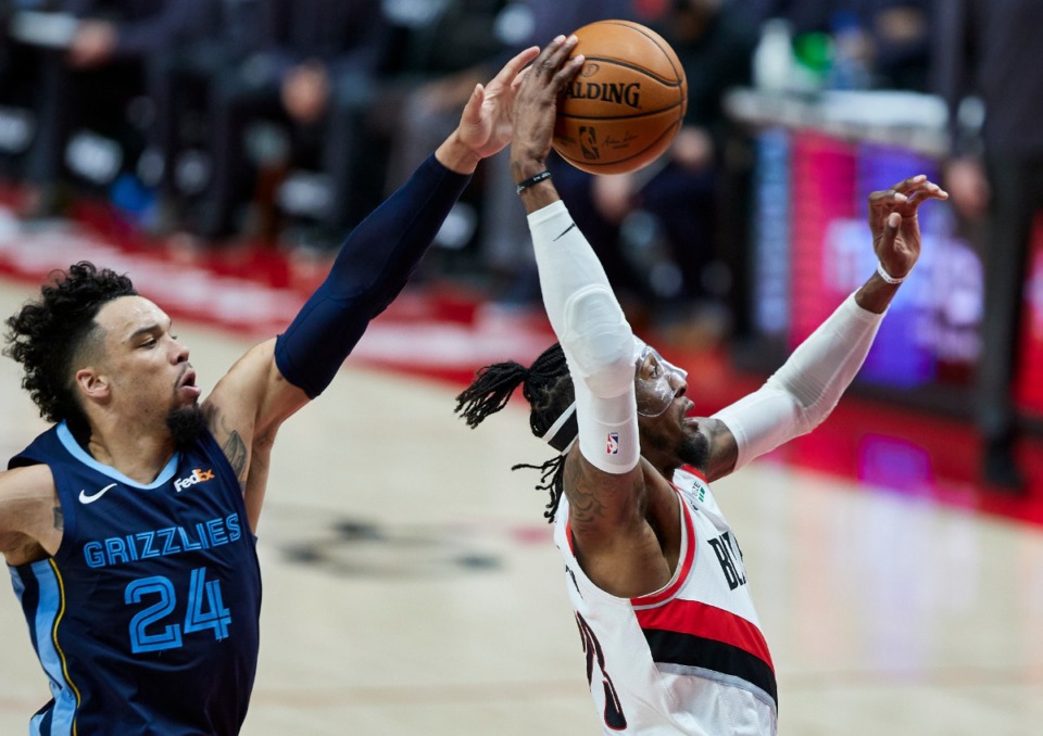 <strong>Portland Trail Blazers forward Robert Covington, right, shoots in front of Memphis Grizzlies forward Dillon Brooks during the first half of an NBA basketball game in Portland, Ore., Sunday, April 25, 2021.</strong>&nbsp;(Craig Mitchelldyer/AP)