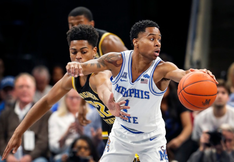 <strong>Then-Memphis guard Tyler Harris&nbsp; moved the ball away from Wichita State defender Grant Sherfield (left) during action Thursday, March 5, 2020 at the FedExForum.</strong> (Mark Weber/Daily Memphian)