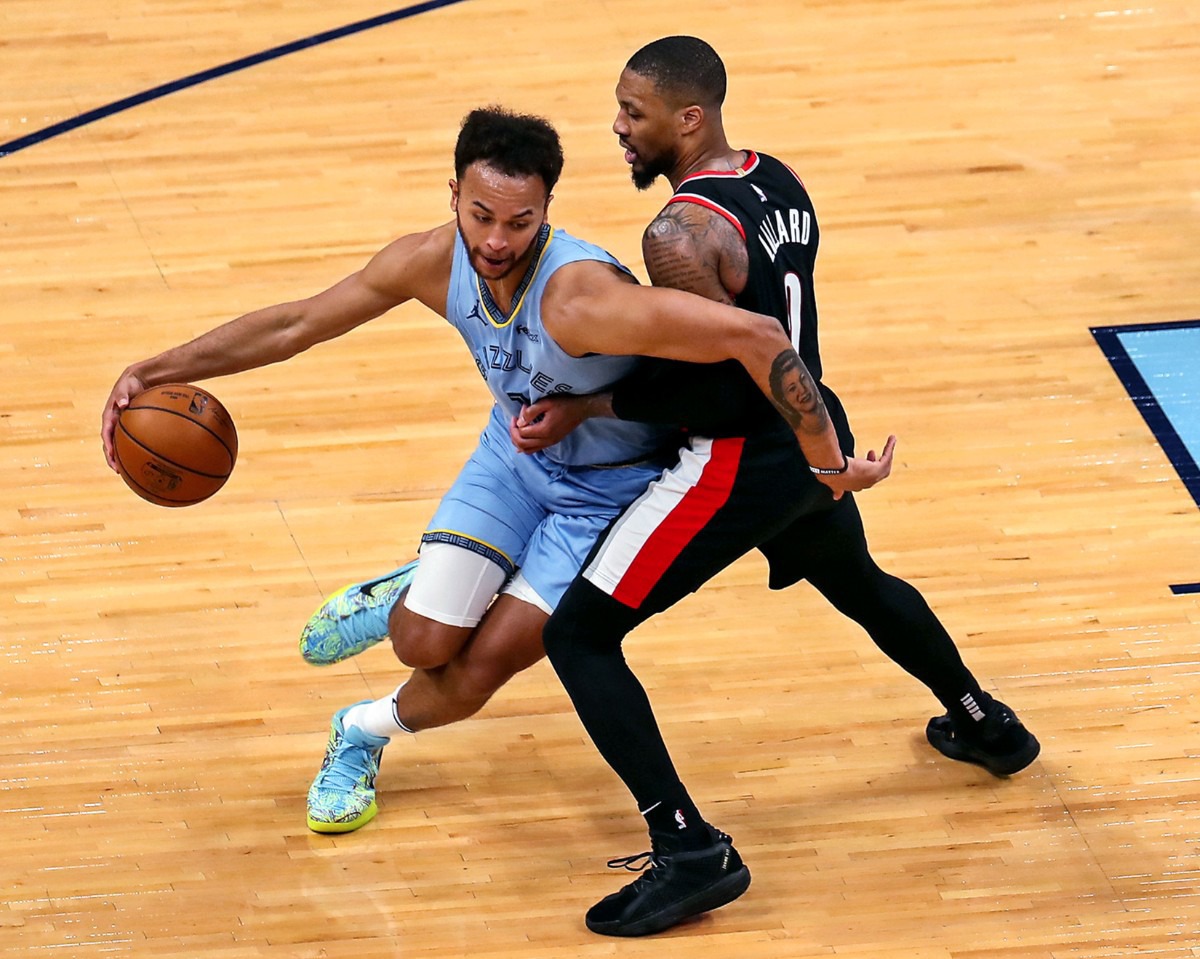 <strong>Grizzlies forward Kyle Anderson (1) tries to get around Portland&rsquo;s Damian Lillard (0) on April 28 at FedExForum.</strong> (Patrick Lantrip/Daily Memphian)
