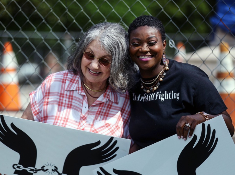 <strong>Jane Abraham (left) and Cherry Self hug during an April 30, 2021 press conference announcing the new home of the Juneteenth Celebration at Health Sciences Park.</strong> (Patrick Lantrip/Daily Memphian)