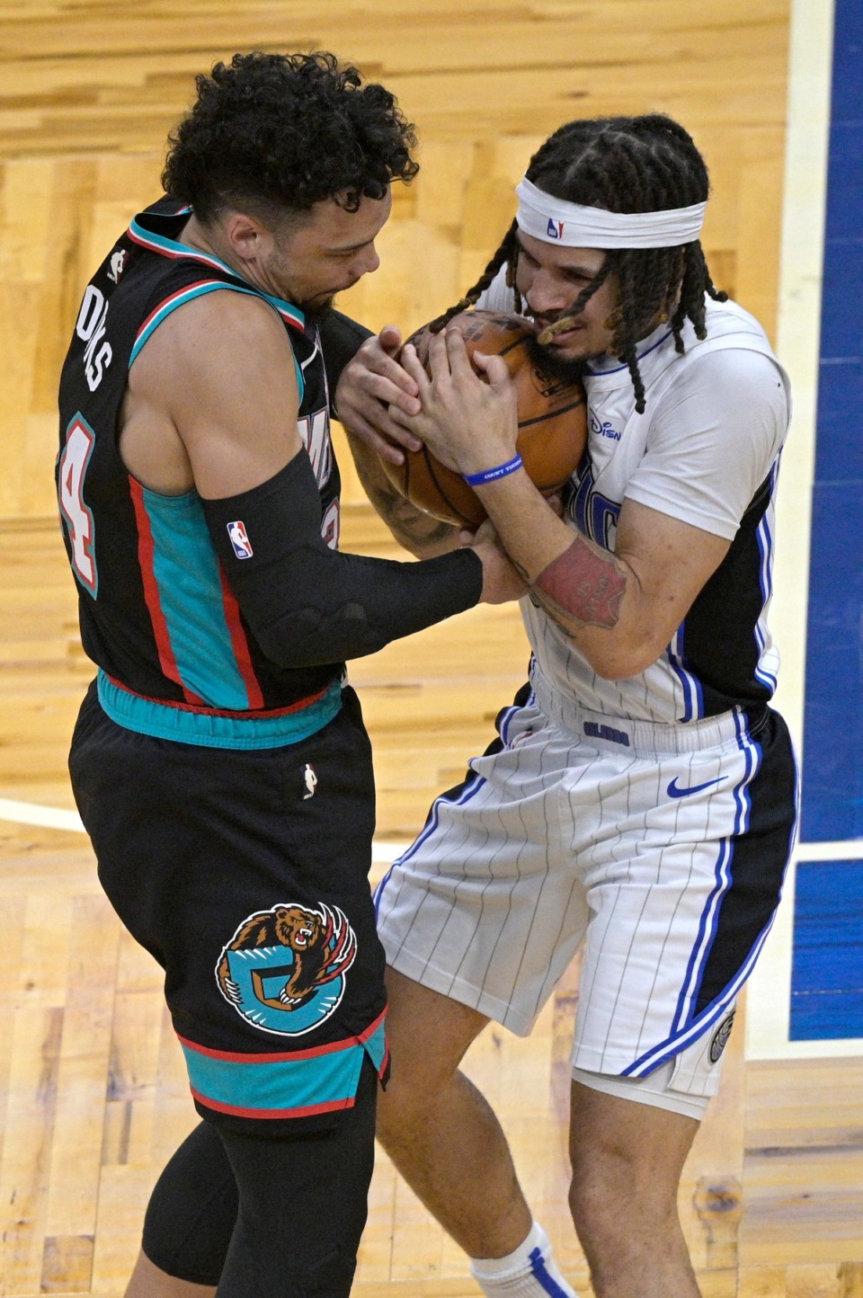 <strong>Memphis Grizzlies forward Dillon Brooks, left, ties up Orlando Magic guard Cole Anthony, forcing a jump ball, during the first half of an NBA basketball game, Saturday, May 1, 2021, in Orlando, Fla.</strong> (Phelan M. Ebenhack/AP)