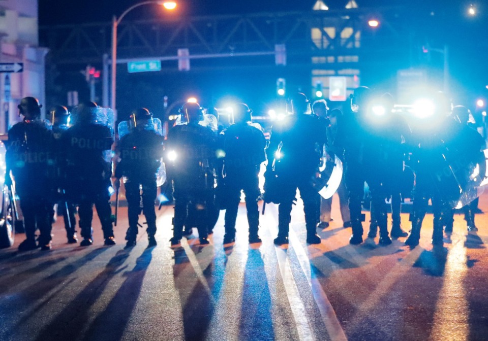 <strong>After the second attempt by protesters to take the Hernando DeSoto Bridge, the Memphis Police Department, decked out in riot gear, follows the remaining protesters throughout Downtown Memphis on June 1, 2020.</strong> (Patrick Lantrip/Daily Memphian)