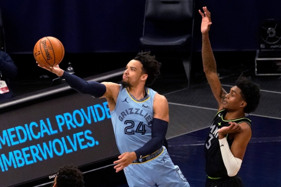 <strong>Grizzlies forward Dillon Brooks (24) shoots past Minnesota&rsquo;s Jaden McDaniels (3) on May 5, 2021, in Minneapolis.</strong> (Jim Mone/AP)