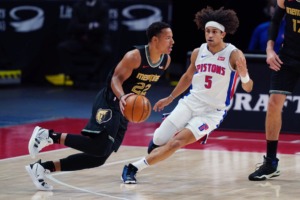 <strong>Grizzlies guard Desmond Bane (22) drives past Detroit&rsquo;s Frank Jackson (5) on May 6, 2021, in Detroit.</strong> (Carlos Osorio/AP)