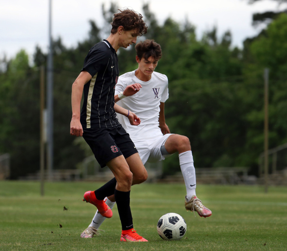 <strong>St. George's Lucas Yanok (11) and Westminster's Peter Hale (7) battle for a loose ball during a May 11, 2021 match.</strong> (Patrick Lantrip/Daily Memphian)