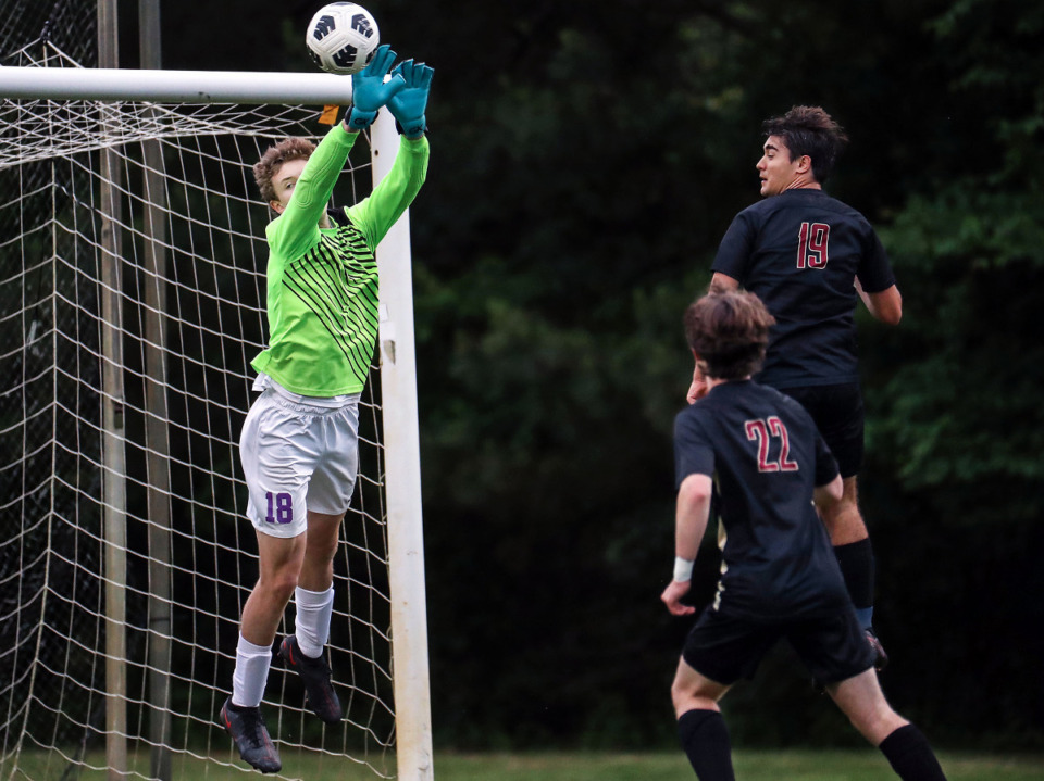 <strong>Westminster goalie Robert Dawkins (18) makes a save during a May 11, 2021 match against St. George's.</strong> (Patrick Lantrip/Daily Memphian)