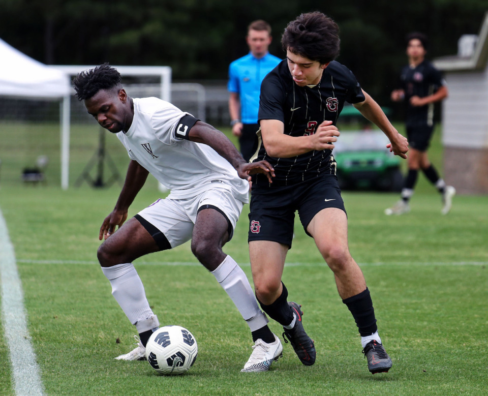 <strong>Westminster's William Bell (10) tries to fend off St. George's Carsten Haddad (9) during Tuesday&rsquo;s region semifinal. </strong>(Patrick Lantrip/Daily Memphian)