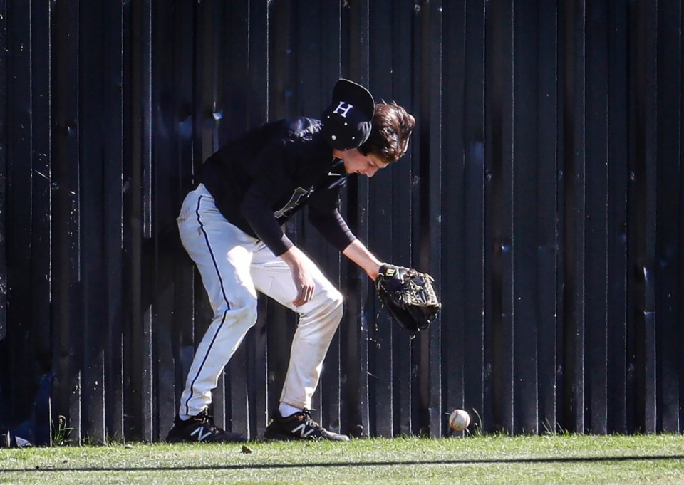 <strong>Houston outfielder Jackson Frederick mishandles a fly ball against Collierville.</strong> (Mark Weber/The Daily Memphian)