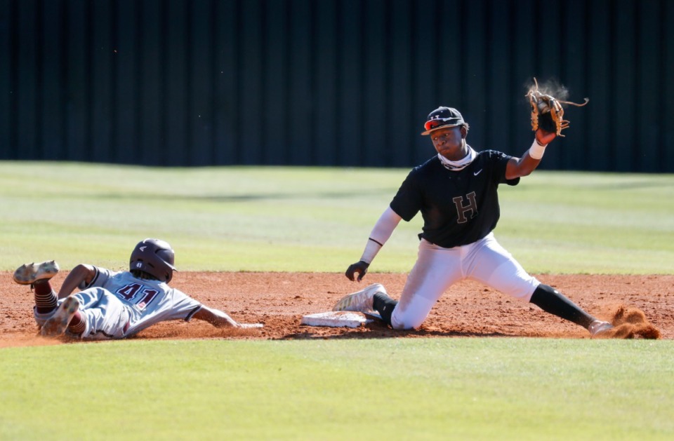 <strong>Collierville runner Austin Smith slides safely into second base in front of Houston second baseman Robinson Martin (right).</strong> (Mark Weber/The Daily Memphian)