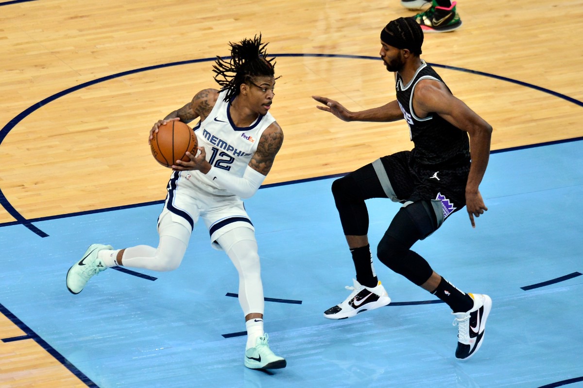 <strong>Memphis Grizzlies guard Ja Morant (12) handles the ball against Sacramento Kings forward Maurice Harkless in the first half of an NBA basketball game Thursday, May 13, 2021, at FedExForum.</strong> (Brandon Dill/AP)