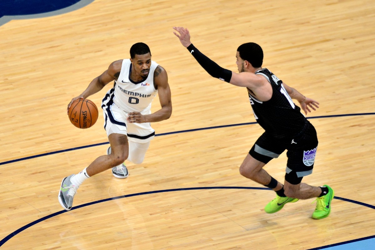 <strong>Memphis Grizzlies guard De'Anthony Melton (0) handles the ball against Sacramento Kings guard Justin James (10) in the first half of an NBA basketball game Thursday, May 13, 2021, in at FedExForum.</strong> (Brandon Dill/AP)