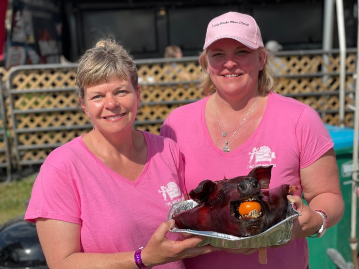 <strong>Karen Overton and Delaniah Bringle are on I Only Smoke When I Drink, an all-female team that competed with a hog Overton raised and they named Earl.</strong> (Jennifer Biggs/Daily Memphian)