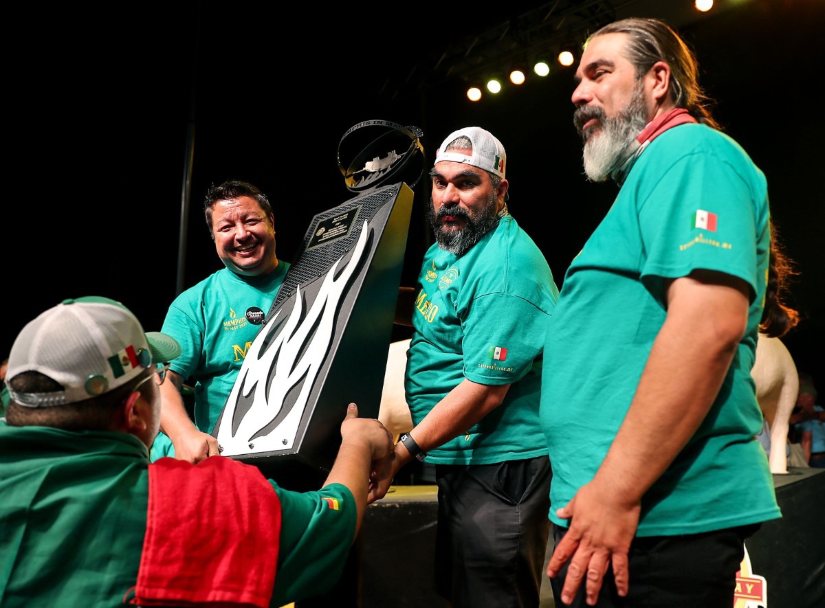 <strong>Members of Mexican BBQ Team celebrate after winning second place in the shoulder category.</strong> (Patrick Lantrip/Daily Memphian)