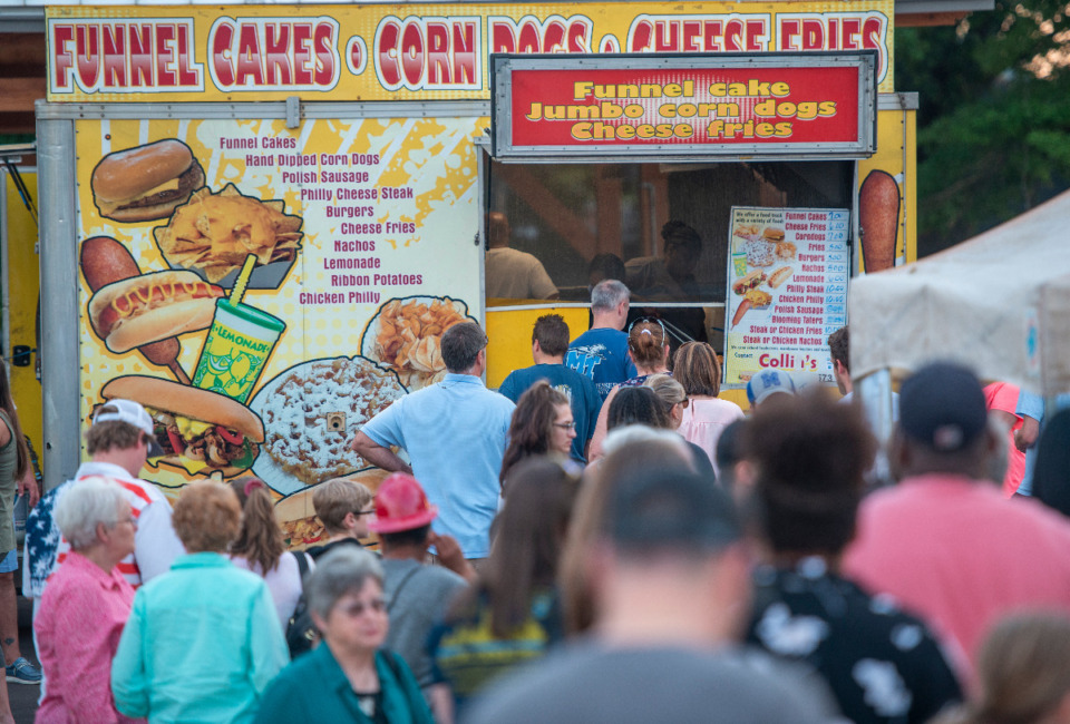 <strong>Crowds line up at the food trucks at The Crossings Amphitheater at Forrest Street Park in Arlington as part of the Music on the Square, Saturday, May 15, 2021.</strong> (Greg Campbell/Special to The Daily Memphian)
