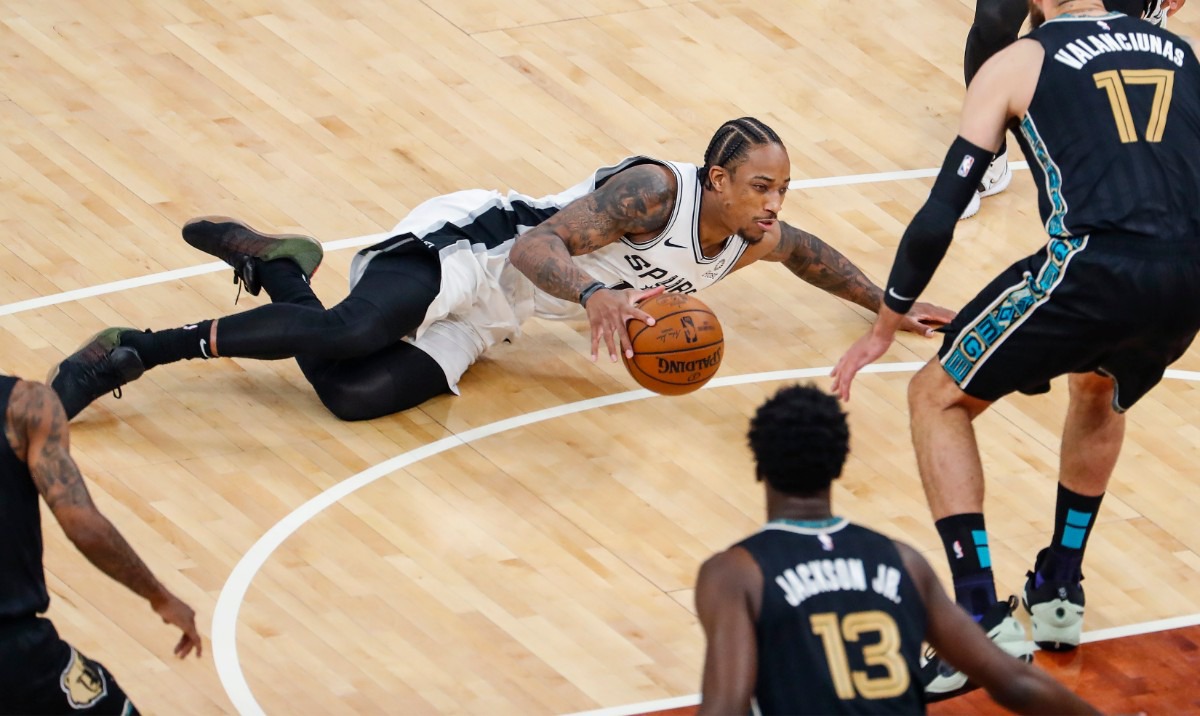 <strong>San Antonio Spurs guard DeMar DeRozan (middle) loses the ball after falling in the game against the Grizzlies on May 19 at FedExForum.</strong> (Mark Weber/The Daily Memphian)