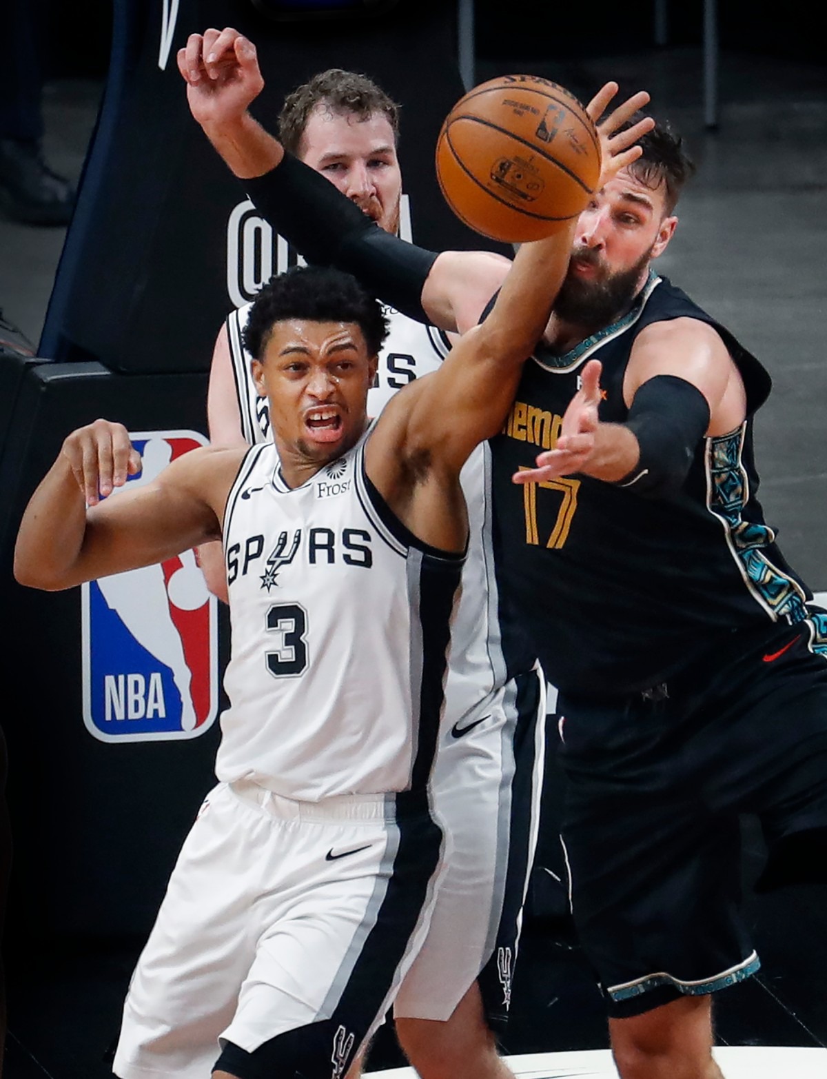 <strong>Grizzlies center Jonas Valanciunas (right) battles San Antonio&rsquo;s Keldon Johnson (left) for a rebound on May 19 at FedExForum.</strong> (Mark Weber/The Daily Memphian)