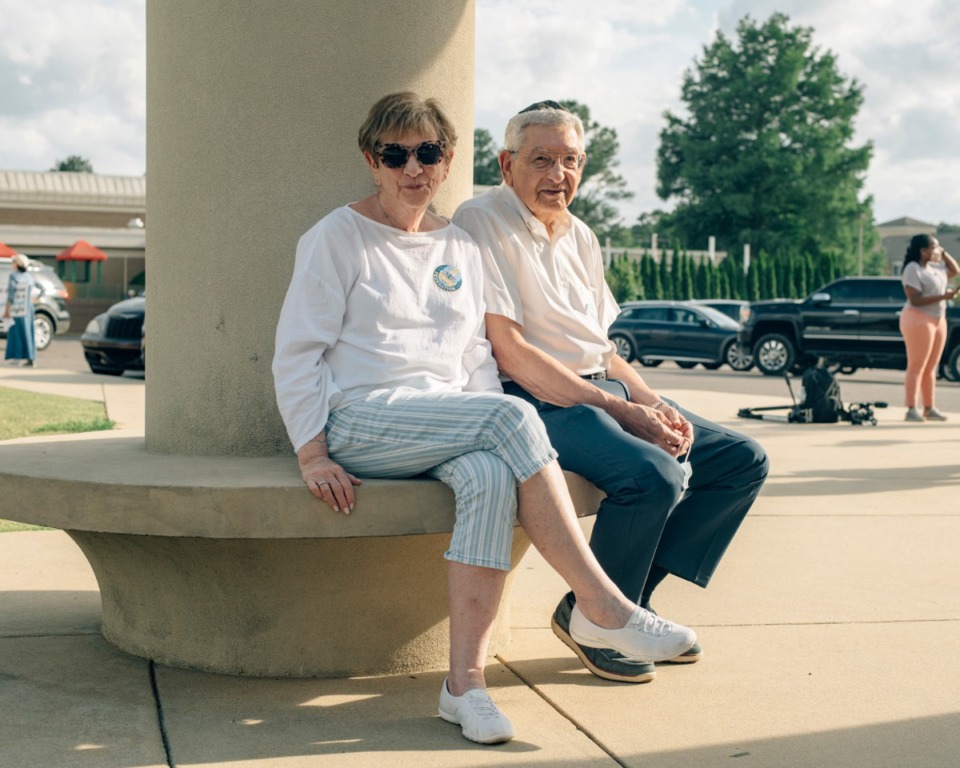 <strong>Mariam Danzig (left) and Bernard Danzig sit outside a pavilion at the Memphis Jewish Community Center May 19 as they wait to hear Jewish community leaders speak about the ongoing conflict between Israelis and Palestinians.</strong>&nbsp;(Houston Cofield/Special to The Daily Memphian)