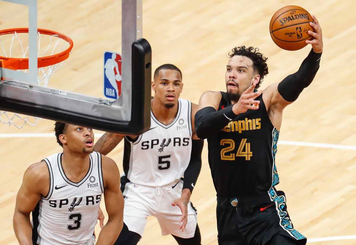 <strong>Grizzlies guard Dillon Brooks drives for a layup against San Antonio&rsquo;s Keldon Johnson (left) and Dejounte Murray (middle) on May 19 at FedExForum.</strong> (Mark Weber/The Daily Memphian)