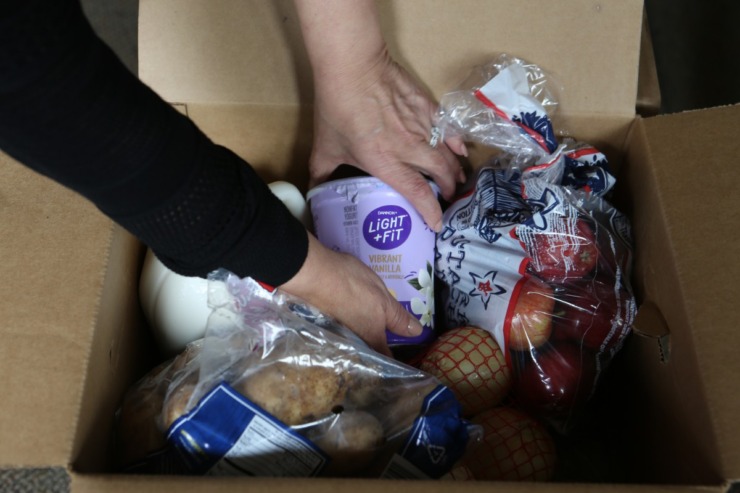 A box holds food donations for domestic violence victims.