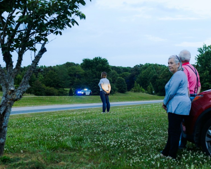 <strong>Pedestrians lined up down Walnut Grove Road near Shelby Farms to honor officer Scott "Scotty" Triplett as the Sea of Blue motorcade made it's 40-mile loop around the city. Triplett was killed last week after he was struck by a car while riding his motorcycle in a motorcade near Hickory Hill.</strong>(Houston Cofield/Special To The Daily Memphian)