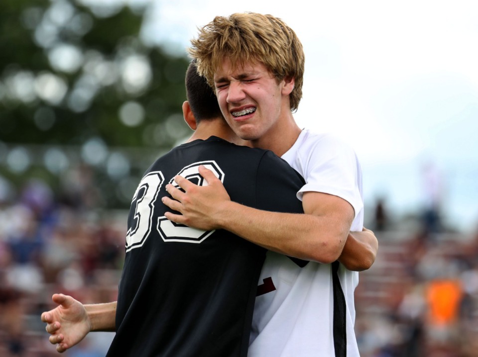 <strong>A Houston High School player comforts Bearden High School defender Cole Hutchison (12) after Houston defeated Bearden in the Class AAA championship game in Murfreesoro, Tennessee, on May 28, 2021.</strong> (Patrick Lantrip/Daily Memphian)