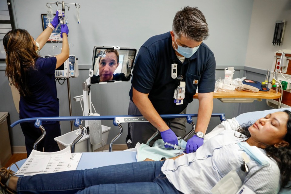 <strong>Dr. Deborah Kerrigan, a neurologist at Vanderbilt Health in Nashville, works remotely via iPad robot with Memphis VA Medical Center staff members as they treat a stroke patient during a Telestroke simulated exercise on Thursday, May 27</strong>. (Mark Weber/Daily Memphian)