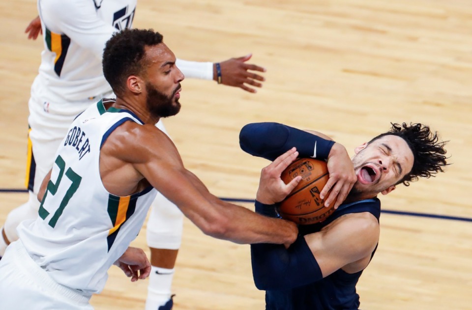 <strong>Memphis Grizzlies guard Dillon Brooks (right) drives to the basket against Utah Jazz defender Rudy Gobert (left) during action of game four of the NBA playoffs on Monday, May 31, 2021.</strong> (Mark Weber/The Daily Memphian)