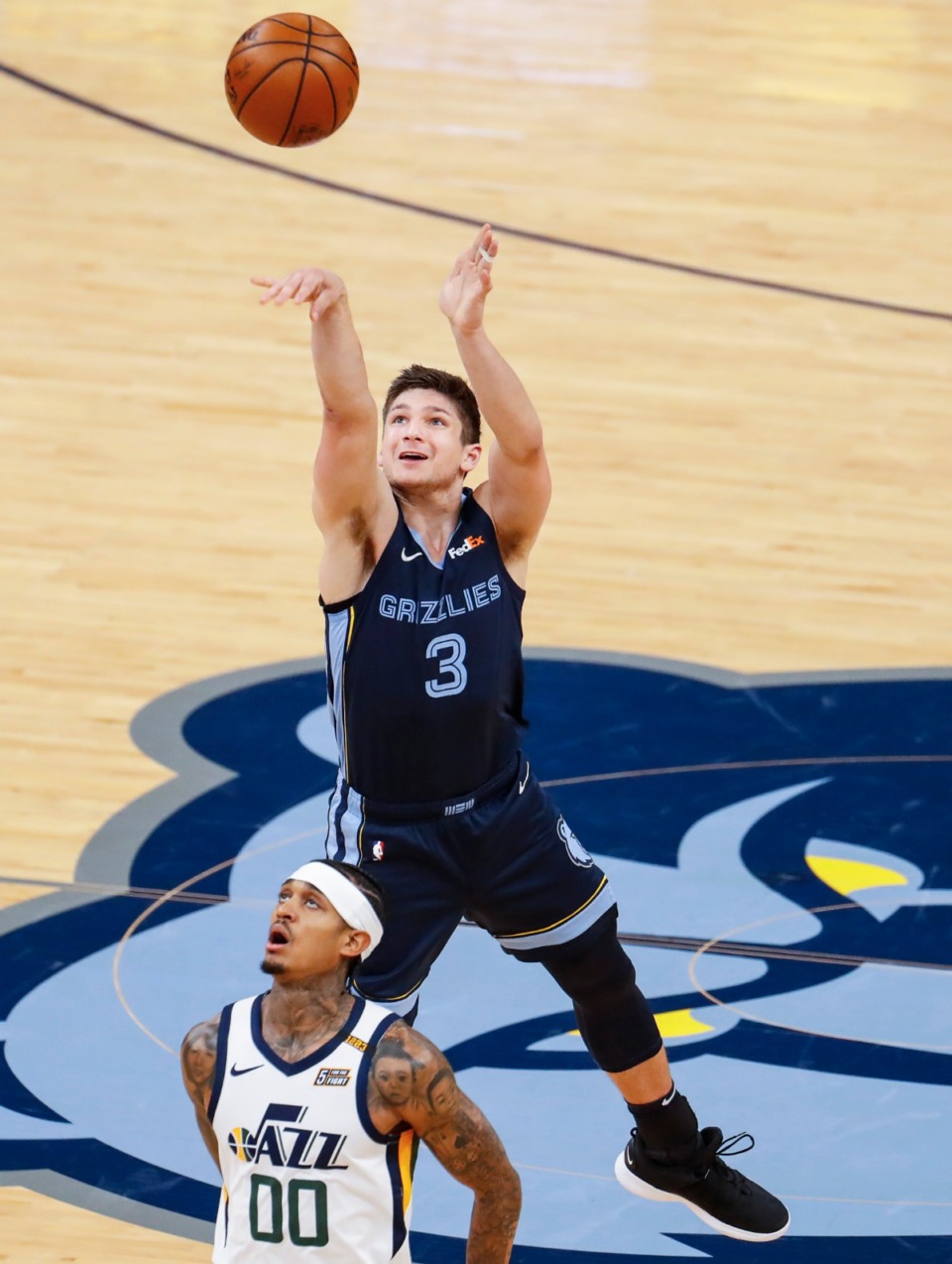 <strong>Memphis Grizzlies guard Grayson Allen (top) shoots a 3-pointer over Utah Jazz defender Jordan Clarkson (bottom) during action of game four of the NBA playoffs on Monday, May 31, 2021.</strong> (Mark Weber/The Daily Memphian)