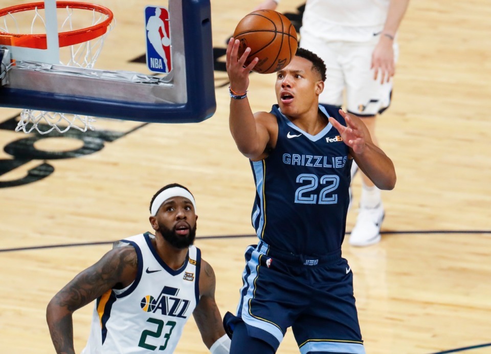 <strong>Memphis Grizzlies forward Desmond Bane (right) drives for a layup in front of Utah Jazz defender Royce O'Neale (left) during action of game four of the NBA playoffs on Monday, May 31, 2021.</strong> (Mark Weber/The Daily Memphian)