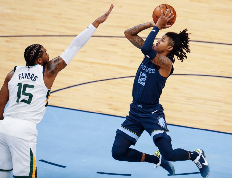 <strong>Memphis Grizzlies guard Ja Morant (right) puts up a shot in front of Utah Jazz defender Derrick Favors (left) during action of game four of the NBA playoffs on Monday, May 31, 2021.</strong> (Mark Weber/The Daily Memphian)
