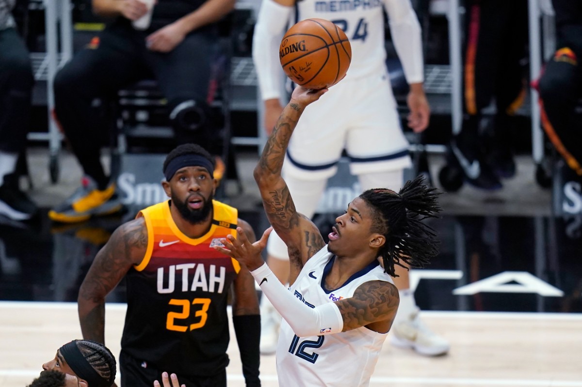 <strong>Grizzlies guard Ja Morant (12) shoots as Utah Jazz forward Royce O'Neale (23) watches on June 2, 2021, in Salt Lake City.</strong> (Rick Bowmer/AP)