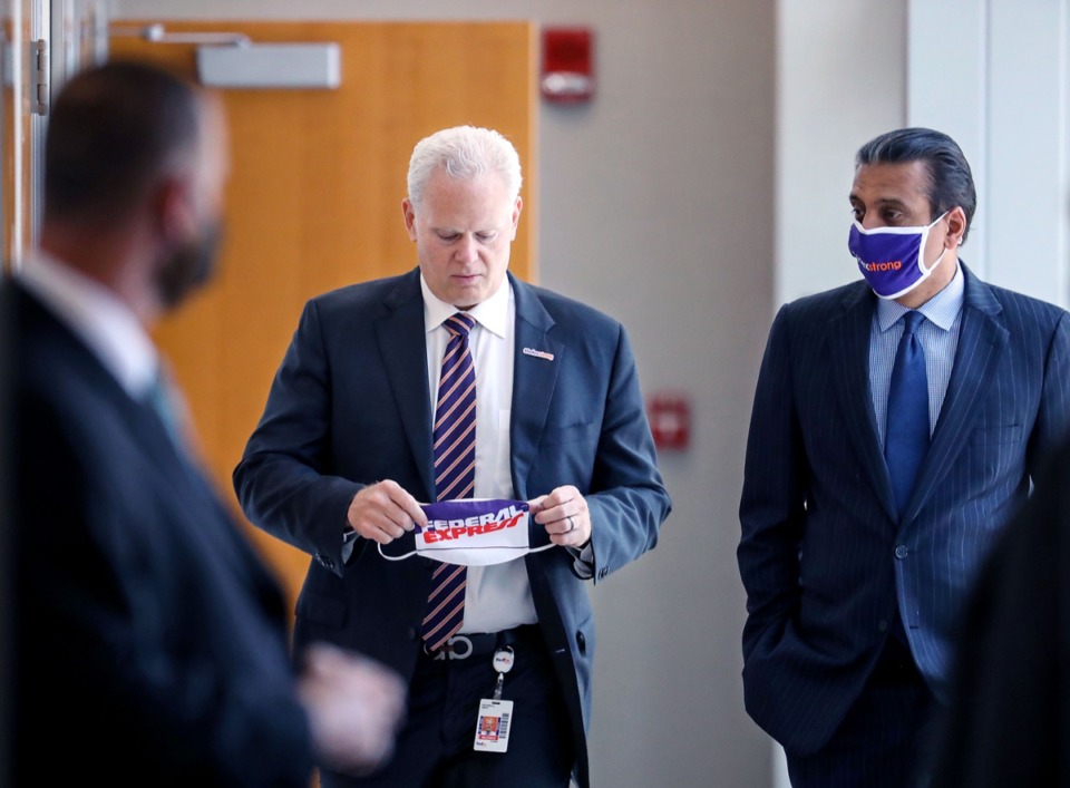 <strong>FedEx regional president of the Americas Richard Smith (center) and CEO Raj Subramaniam walk into a meeting with Secretary of Transportation Pete Buttigieg June 3, 2021.</strong> (Patrick Lantrip/Daily Memphian)