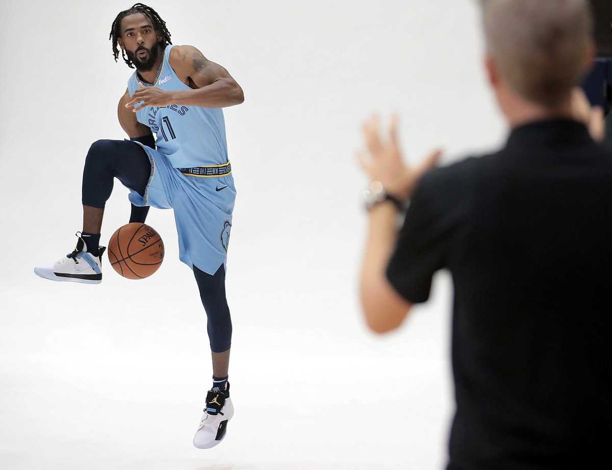 <strong>Mike Conley adds a little action to his portrait sitting during the annual Grizzlies media day at the FedExForum on Sept. 24, 2018.</strong> (Jim Weber/Daily Memphian)