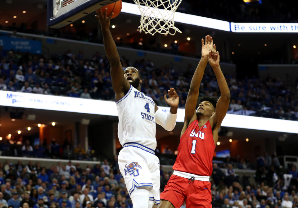 <strong>University of Memphis senior forward Raynere Thornton (4) leaps for a layup against SMU forward Feron Hunt (1) Jan. 19, 2019. Scoring has shifted to the back burner for Thornton in recent games as he works to become a more complete player.</strong> (Houston Cofield/Daily Memphian)