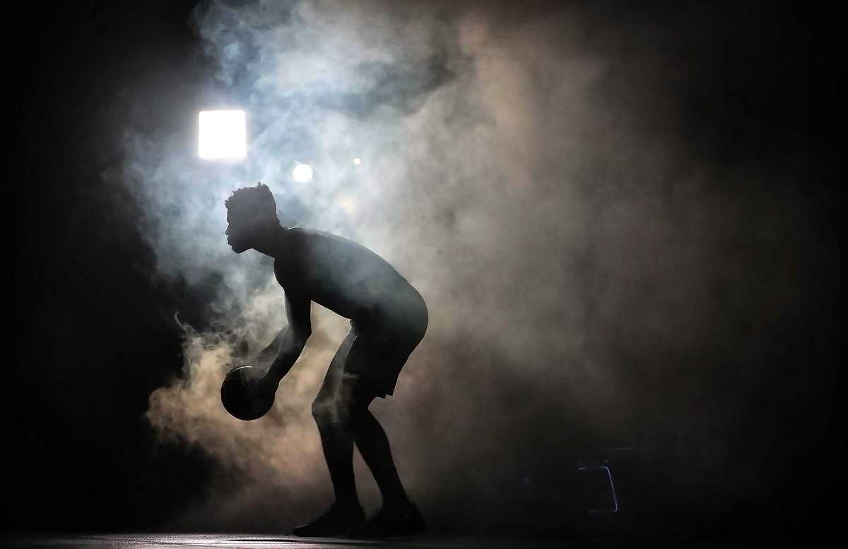 <strong>A film crew turns up the smoke as Andrew Harrison shoots film shorts during the annual Grizzlies media day at the FedExForum on Sept. 24, 2018.</strong> (Jim Weber/Daily Memphian)